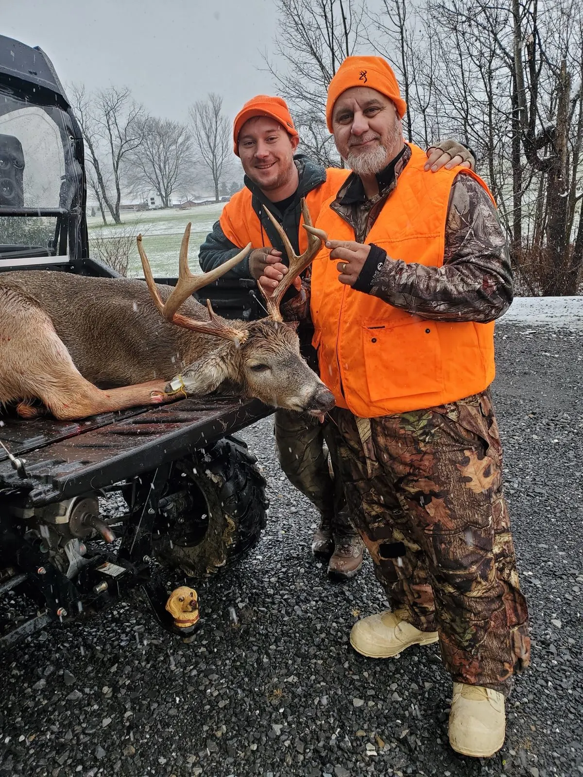 TrophyTracks founder Dan with his father during a successful hunting trip, showcasing the father-son tradition that inspired the hunting app